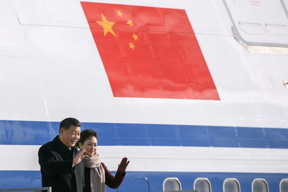 China's President Xi Jinping (L) and his wife Peng Liyuan wave upon their arrival for a state visit to Switzerland on January 15, 2017 at Zurich Airport. Xi Jinping begins a two-day state visit to Switzerland before heading to Davos to address the World Economic Forum. / AFP / FABRICE COFFRINI (Photo credit should read FABRICE COFFRINI/AFP/Getty Images)
